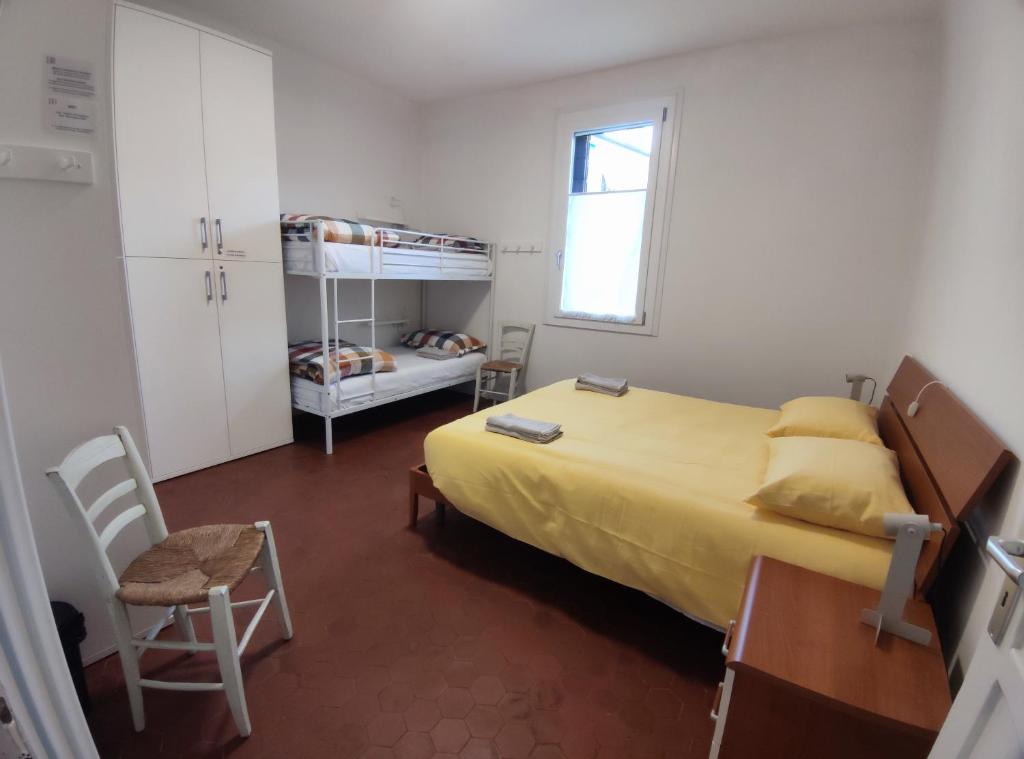 a bedroom with a bed and a bunk bed at BBConegliano Bixio in Conegliano