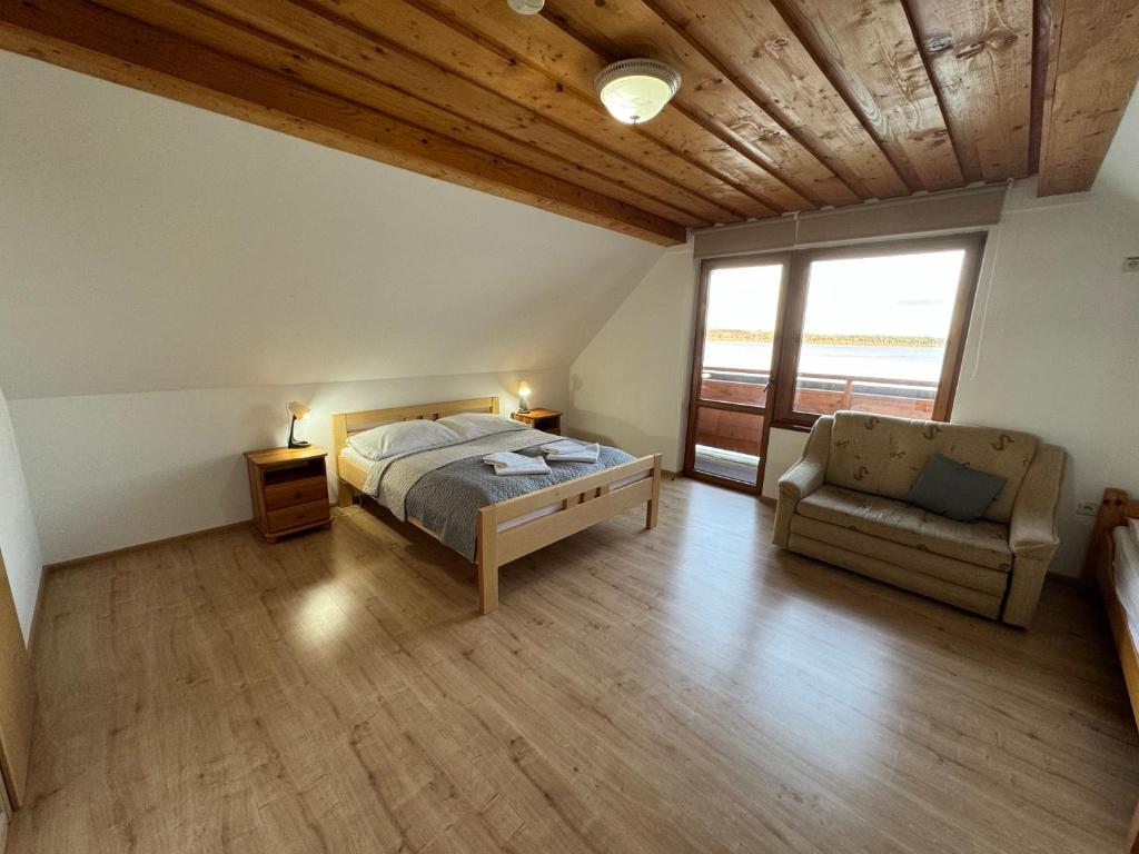 Postel nebo postele na pokoji v ubytování Slanický Dvor
