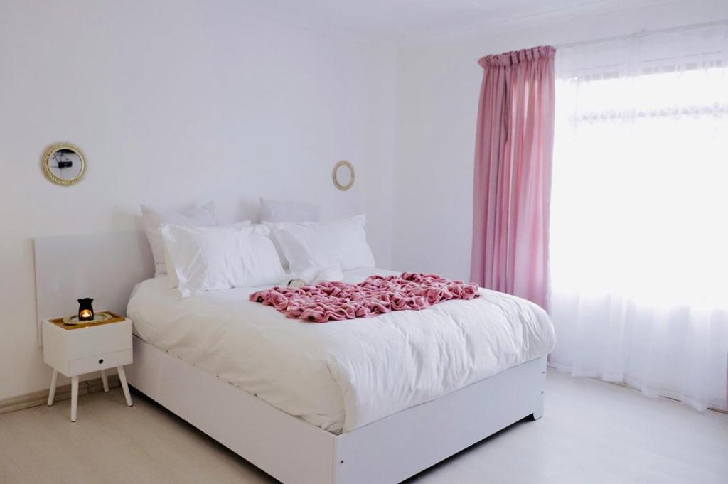 Ένα ή περισσότερα κρεβάτια σε δωμάτιο στο Lake Acres Guest House
