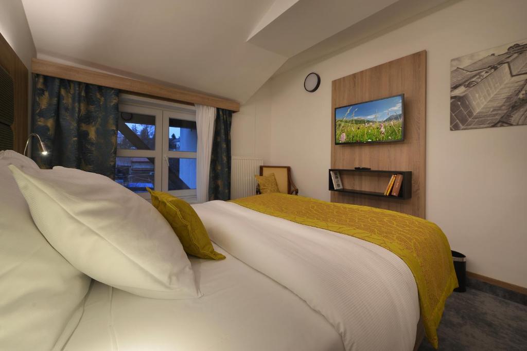 Łóżko lub łóżka w pokoju w obiekcie Vysocina Design Apartments