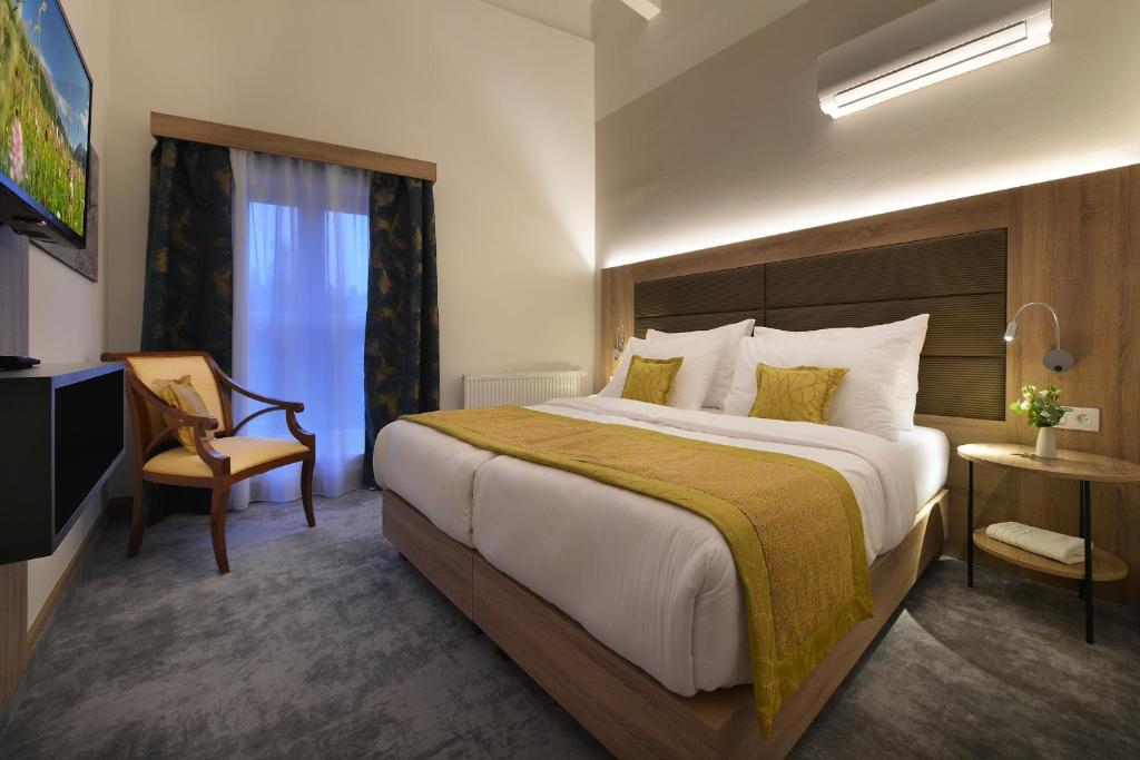 Łóżko lub łóżka w pokoju w obiekcie Vysocina Design Apartments