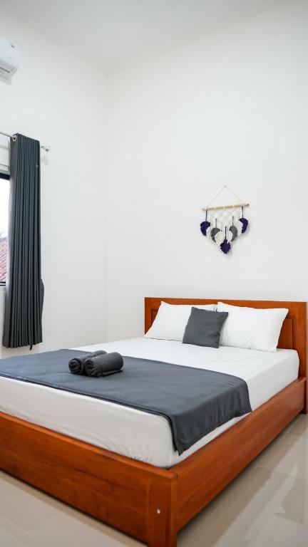 Postel nebo postele na pokoji v ubytování Wangi Homestay