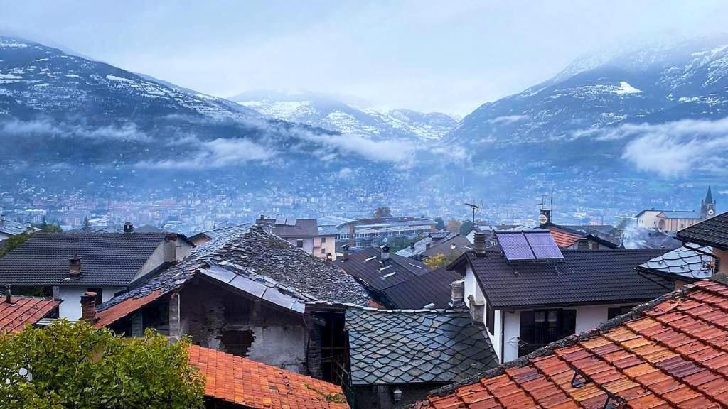 a view of a town with mountains in the background at B&B da Lule in Aosta