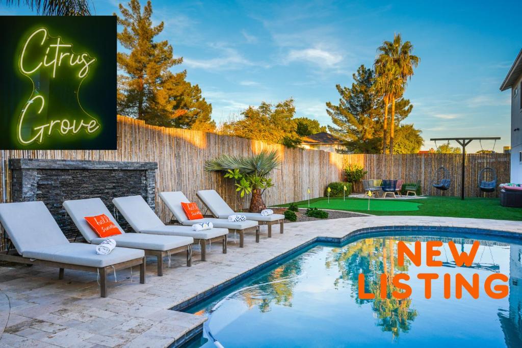 a patio with lounge chairs and a swimming pool at Citrus Grove in Mesa
