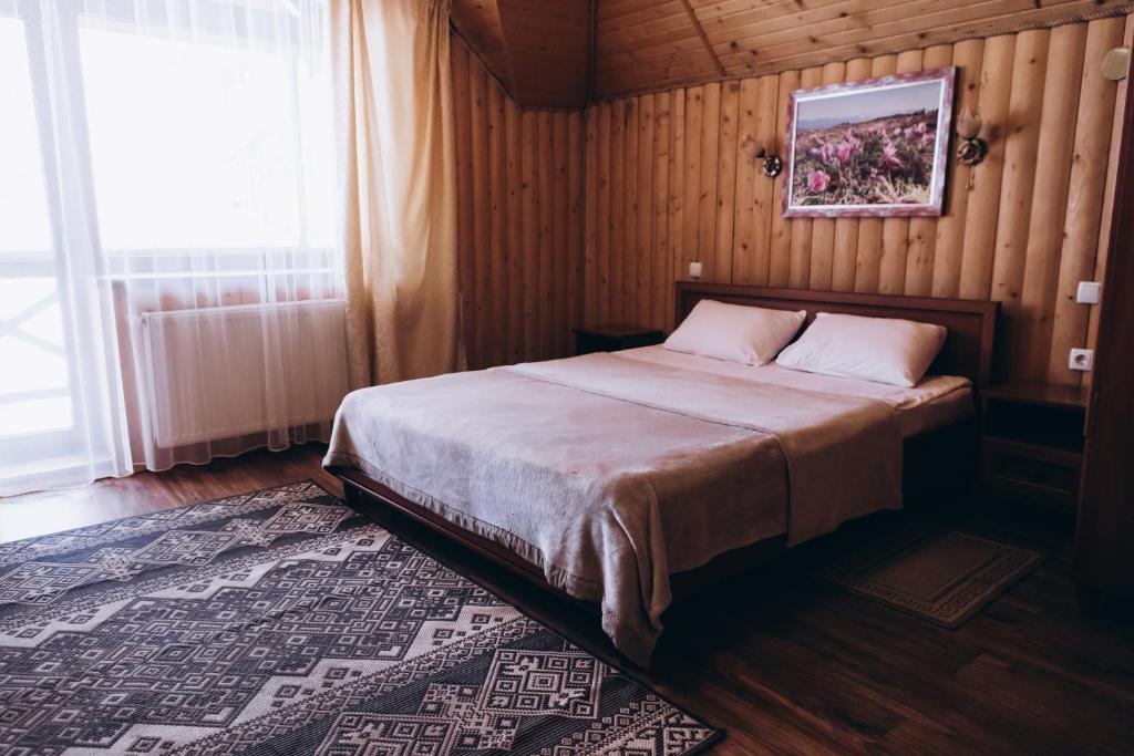 Postel nebo postele na pokoji v ubytování Новий