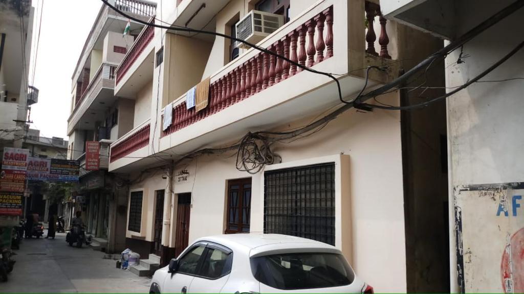 a white car parked in front of a building at lalit cottage central town, phagwara in Phagwāra