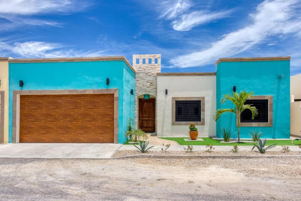 a blue and white house with a garage at Walkable, Convenient in Downtown Los Barriles in Los Barriles