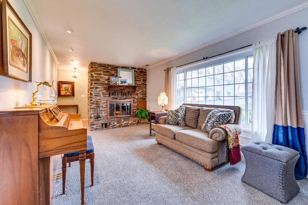 a living room with a couch and a fireplace at East Wenatchee Home about 2 Mi to Columbia River! in East Wenatchee