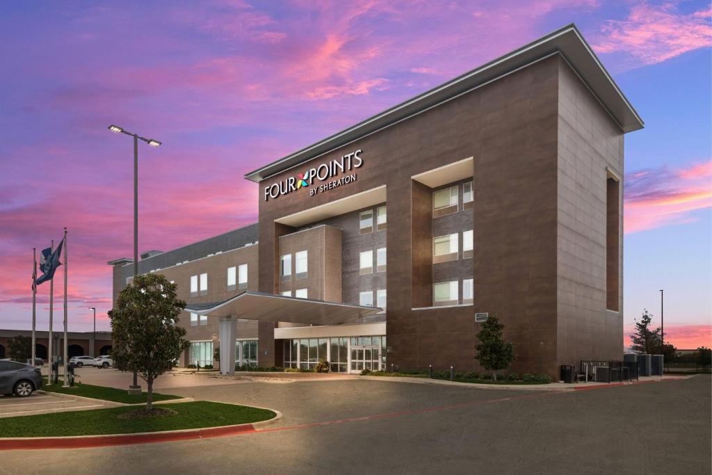 a rendering of the front of a building at Four Points by Sheraton Plano in Plano