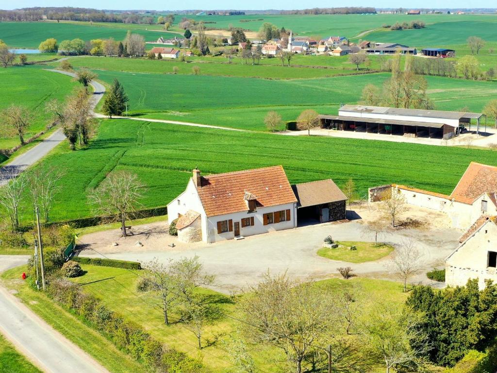 an aerial view of a house in a field at Gîte La Celette, 4 pièces, 6 personnes - FR-1-586-27 