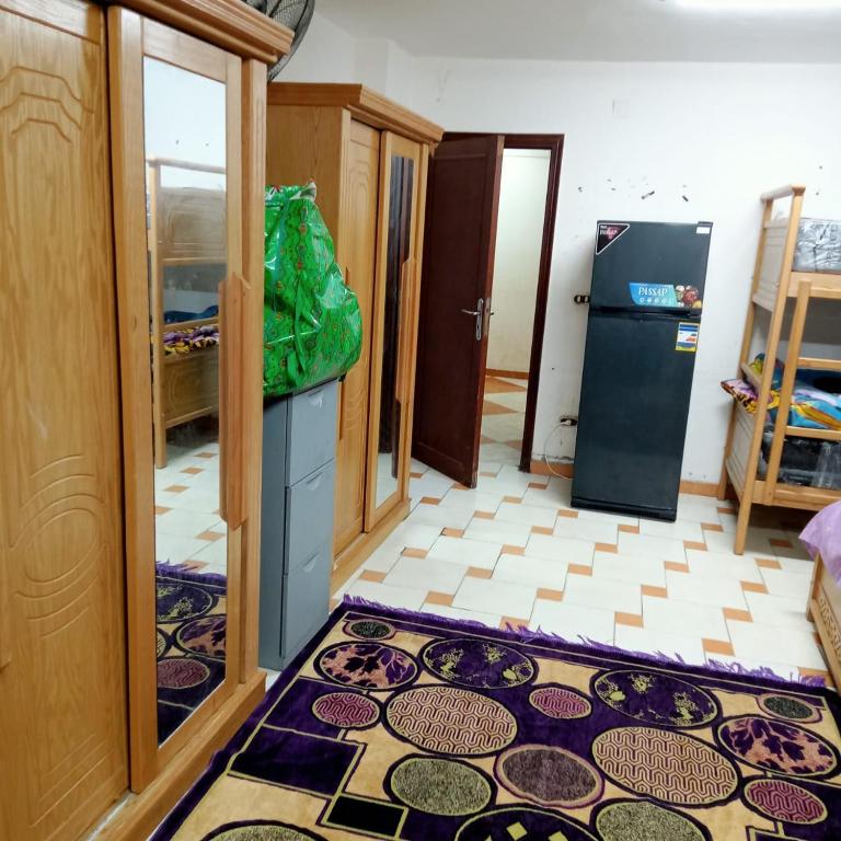 Postel nebo postele na pokoji v ubytování بيت الطالبات والمغتربات