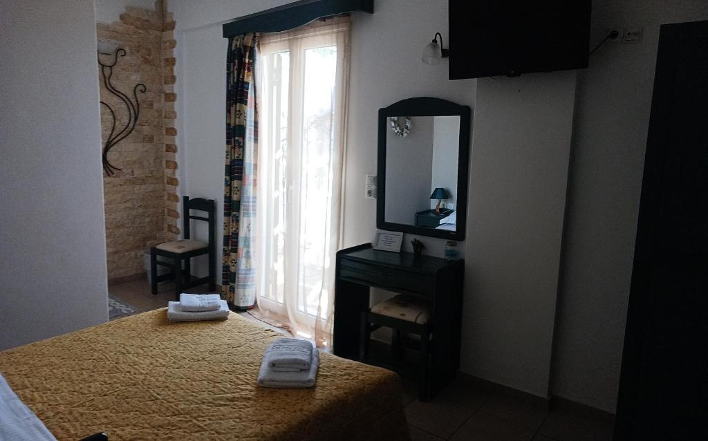 Posteľ alebo postele v izbe v ubytovaní Πικροδάφνες