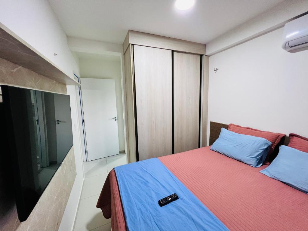 a bedroom with a bed and a large window at Apartamento novo zona leste. in Teresina