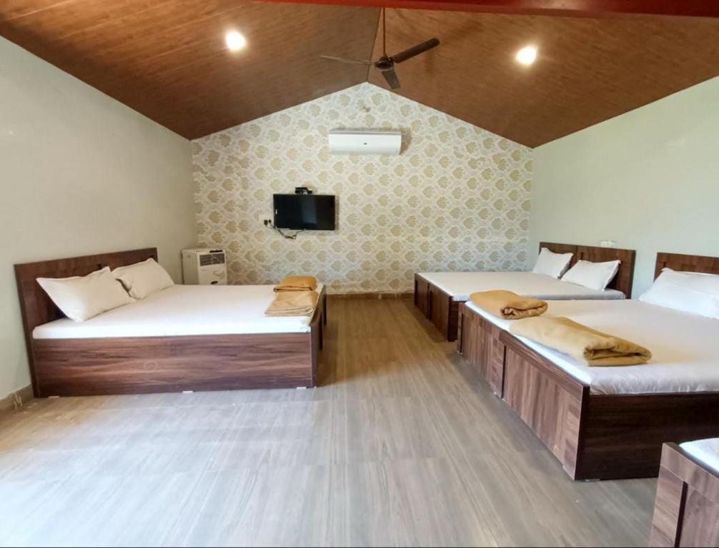 Postel nebo postele na pokoji v ubytování Mysticstays Resort