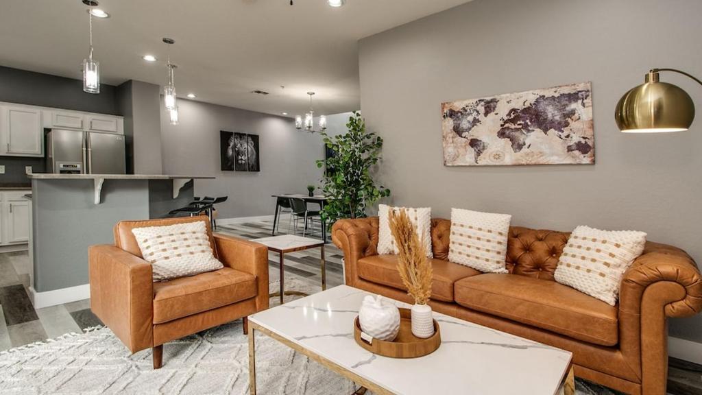 a living room with two couches and a kitchen at 3 Bdrm Townhouse WGarage in Gated Complex in Phoenix