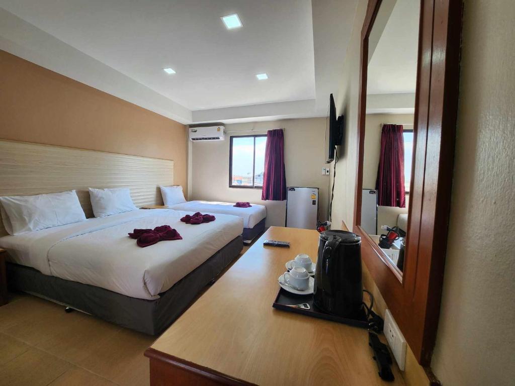 Postel nebo postele na pokoji v ubytování White Rose​ Hotel​ II​