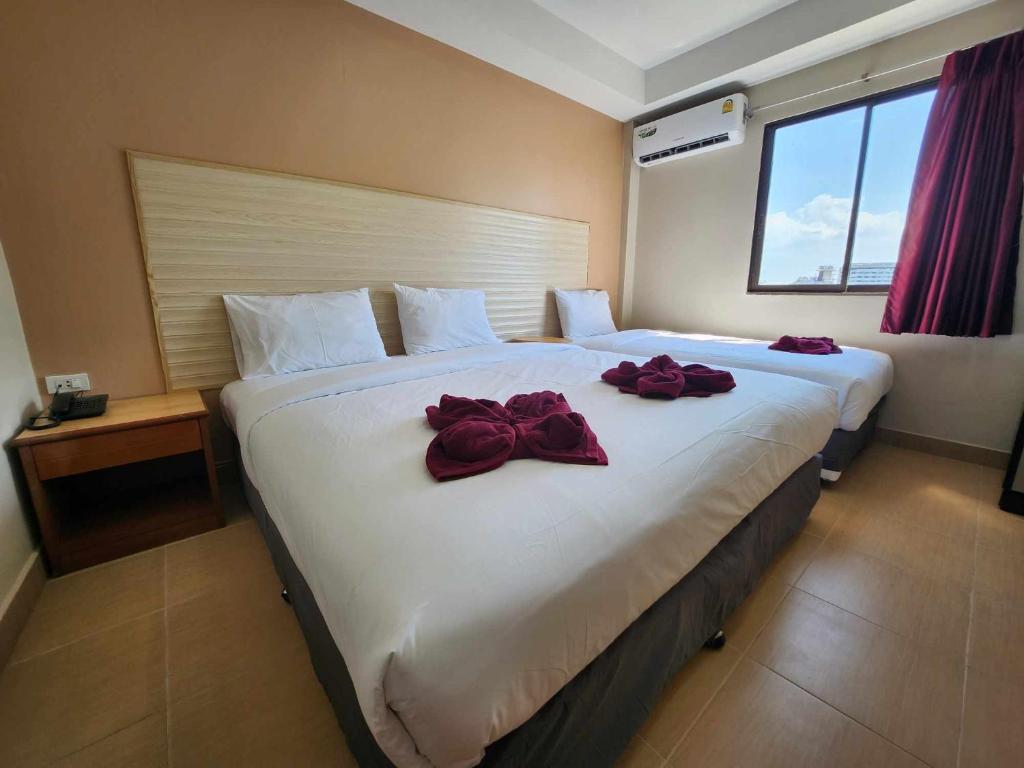 Postel nebo postele na pokoji v ubytování White Rose​ Hotel​ II​