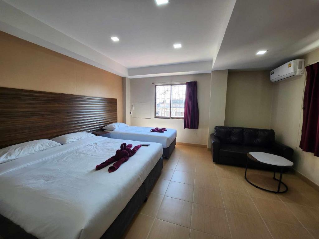 Postel nebo postele na pokoji v ubytování White Rose​ Hotel​ II​