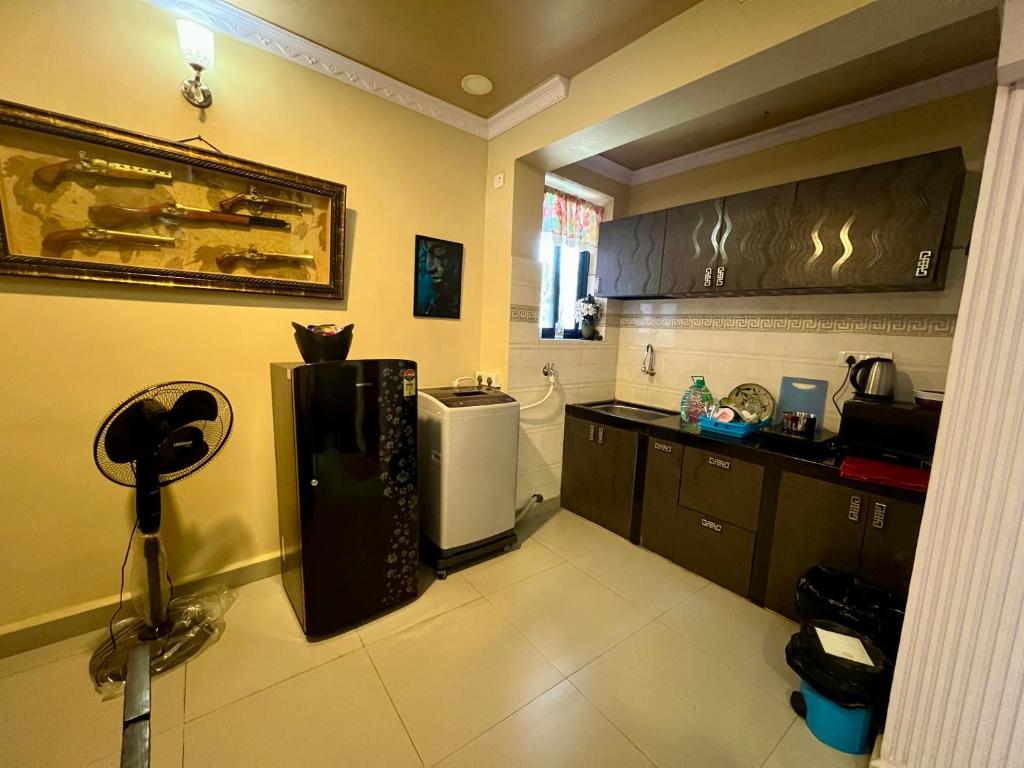 Kuchyň nebo kuchyňský kout v ubytování Fernandes Homestay- Amor
