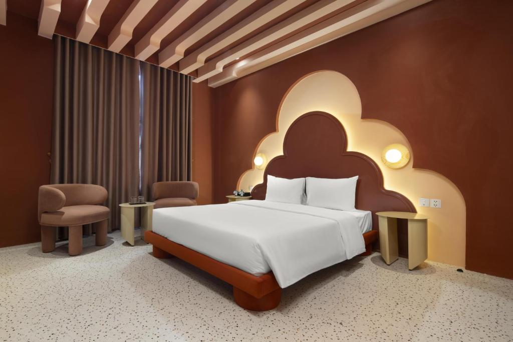 Postel nebo postele na pokoji v ubytování Jacayl Hotel HD