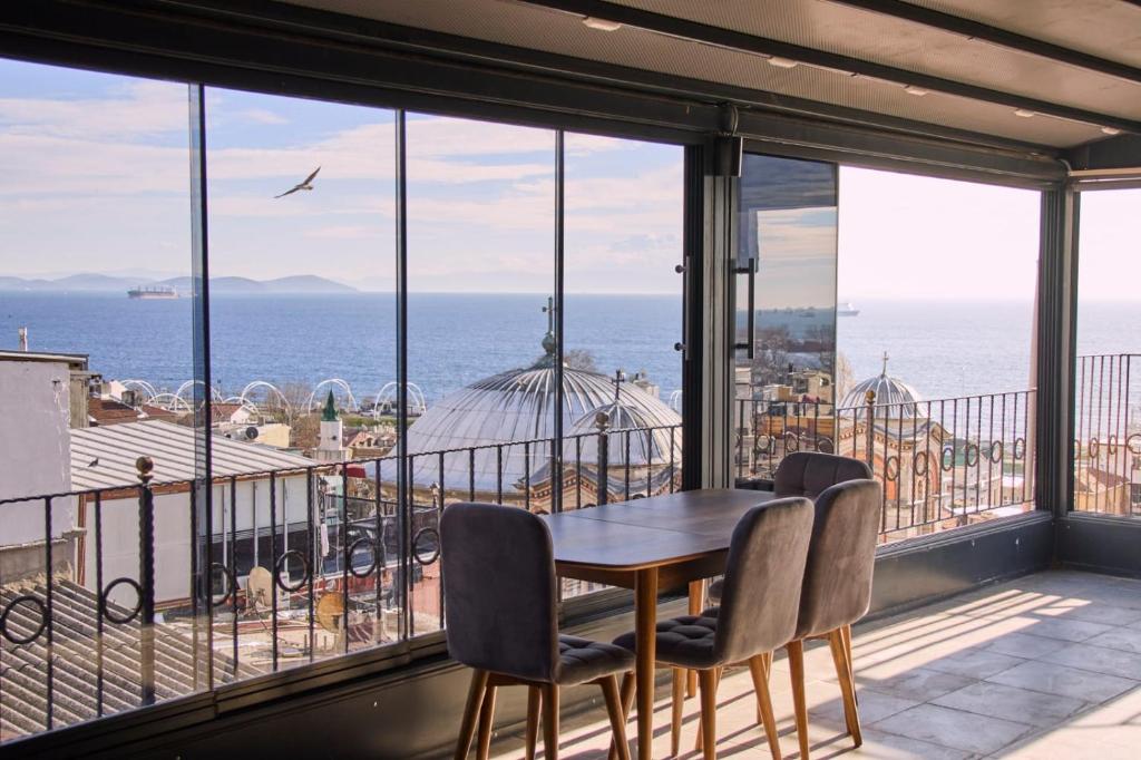 a dining room with a view of the ocean at Sabina Hotel near Grand Bazaar, city center in Istanbul