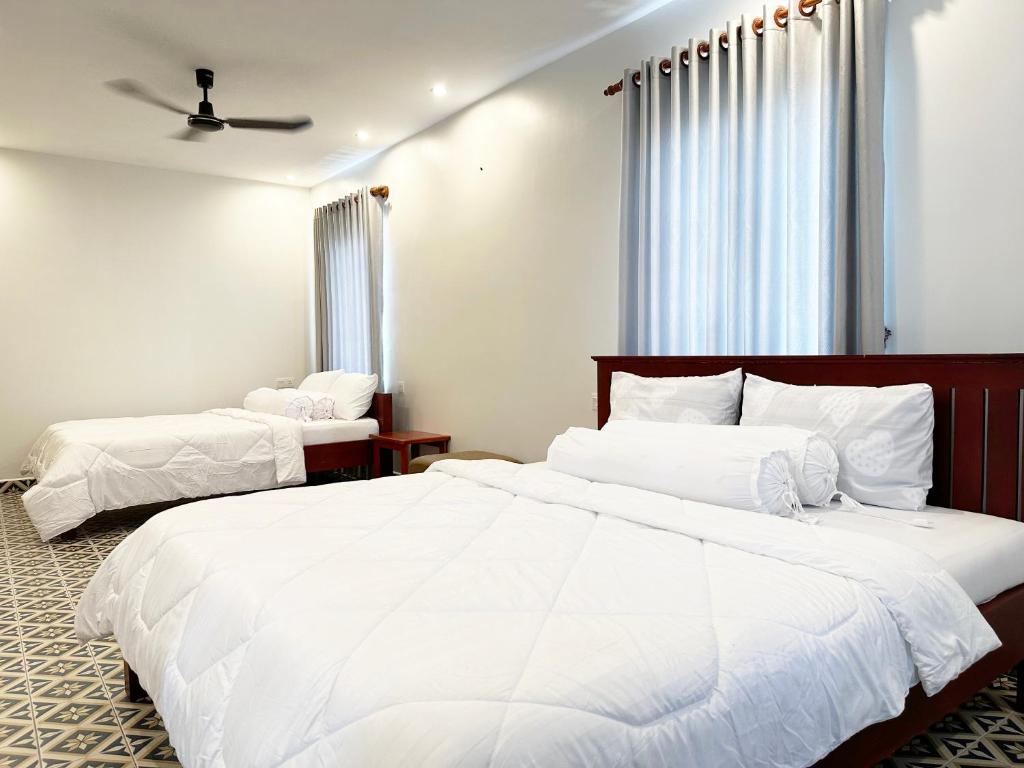 Postel nebo postele na pokoji v ubytování Eco Inn