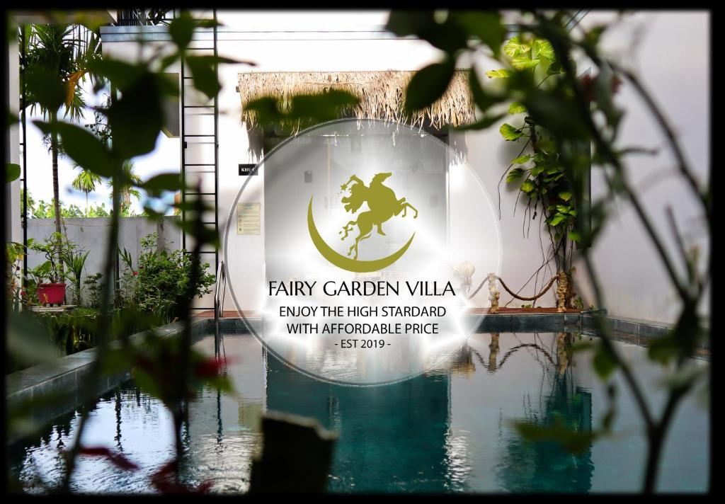 a sign that reads rainy garden villa across the topinated with apostropherophe at Hoi An Fairy Garden Villa in Hoi An