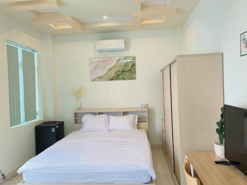 Postel nebo postele na pokoji v ubytování Góc Hải Phòng Drinks & Homestay Q4