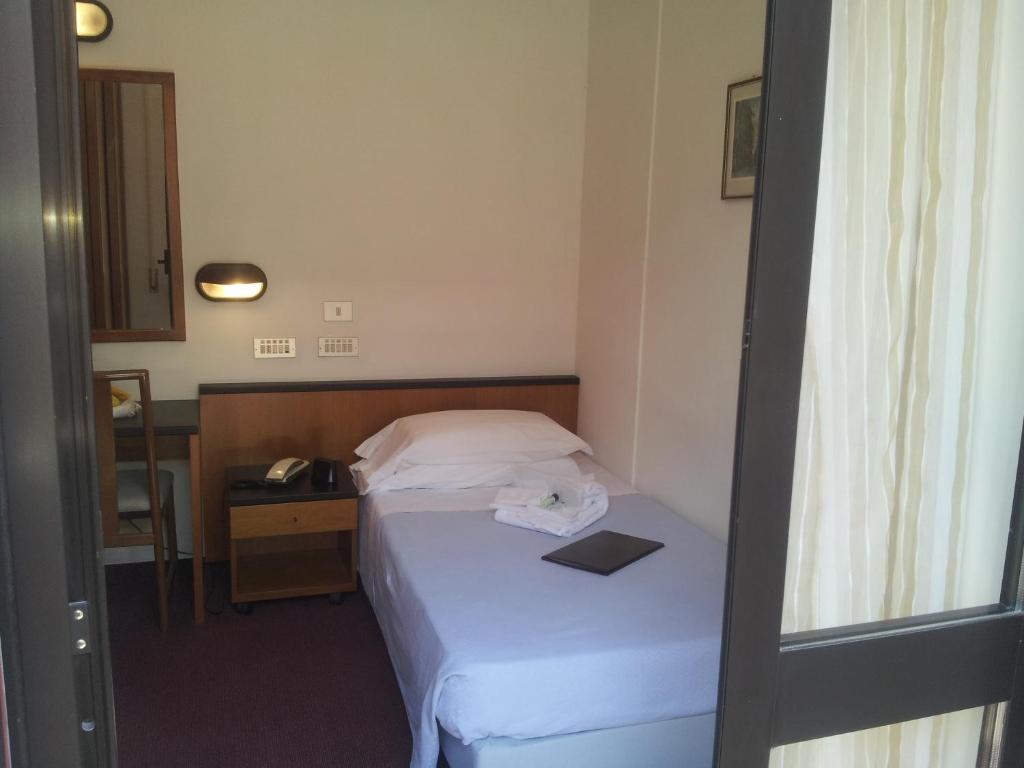 Postel nebo postele na pokoji v ubytování Hotel Montecarlo