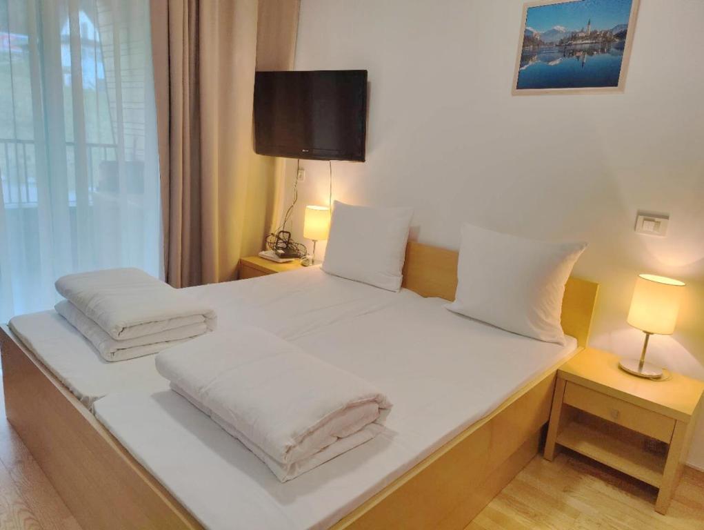 Postel nebo postele na pokoji v ubytování Villa Mari I