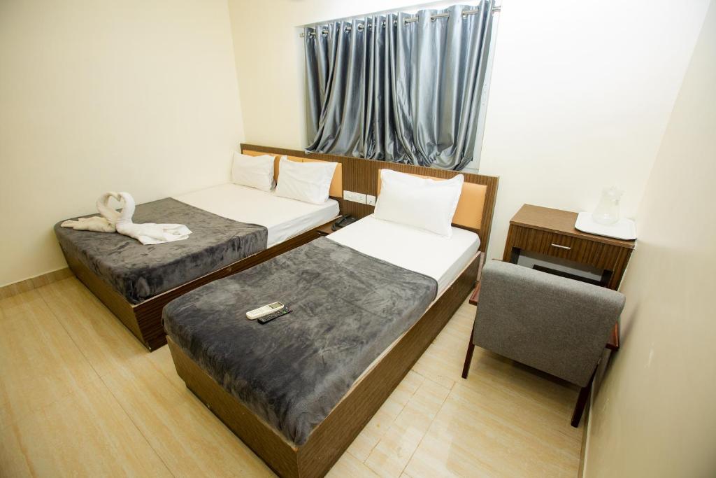 Postel nebo postele na pokoji v ubytování THE PARK AVENUE HOTEL - Business Class Hotel Near Central Railway Station Chennai Periyamet