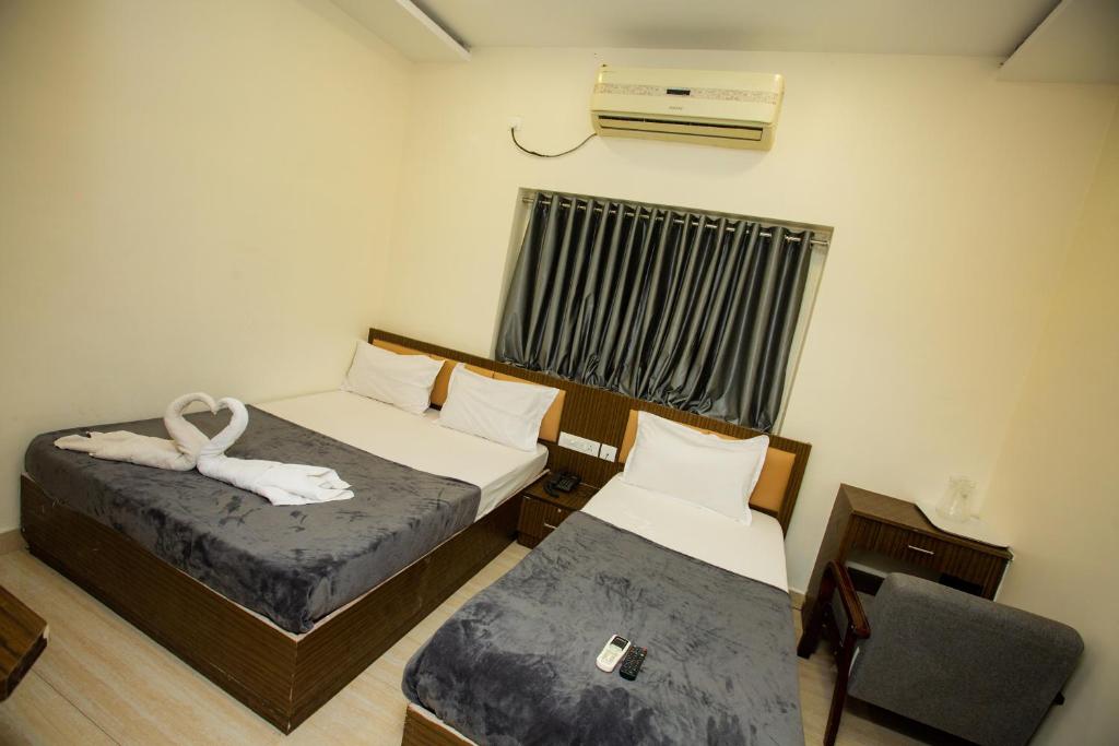 Postel nebo postele na pokoji v ubytování THE PARK AVENUE HOTEL - Business Class Hotel Near Central Railway Station Chennai Periyamet