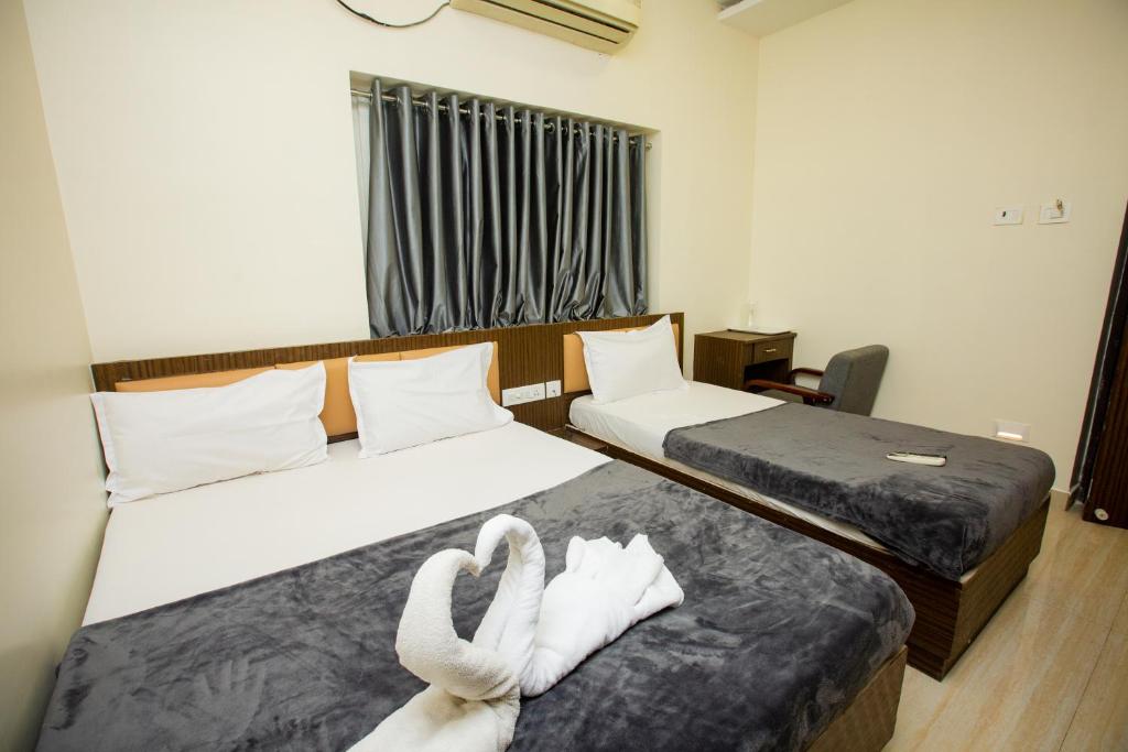 Postel nebo postele na pokoji v ubytování THE PARK AVENUE HOTEL - Business Class Hotel Near Central Railway Station Chennai Periyamet