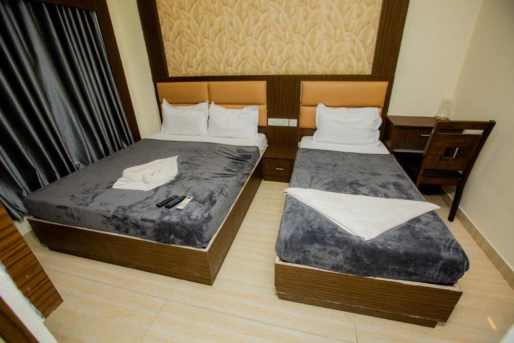 Postel nebo postele na pokoji v ubytování THE PARK AVENUE HOTEL - Business Class Hotel Near Central Railway Station Chennai Periyamet