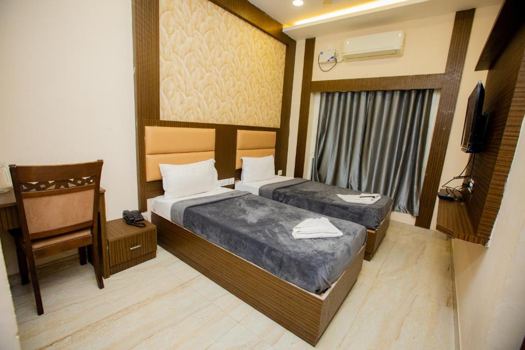 Postel nebo postele na pokoji v ubytování THE PARK AVENUE HOTEL - Business Class Hotel Near Central Railway Station Chennai Periyamet