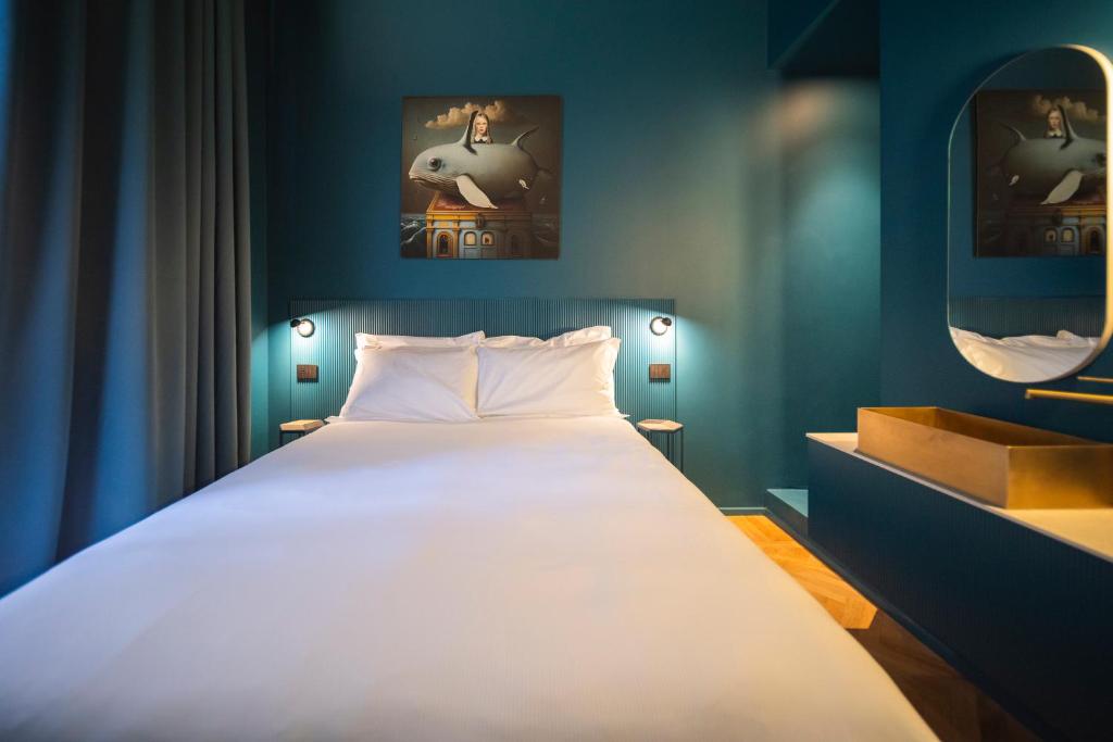 Postel nebo postele na pokoji v ubytování Fontana 16 Rooms
