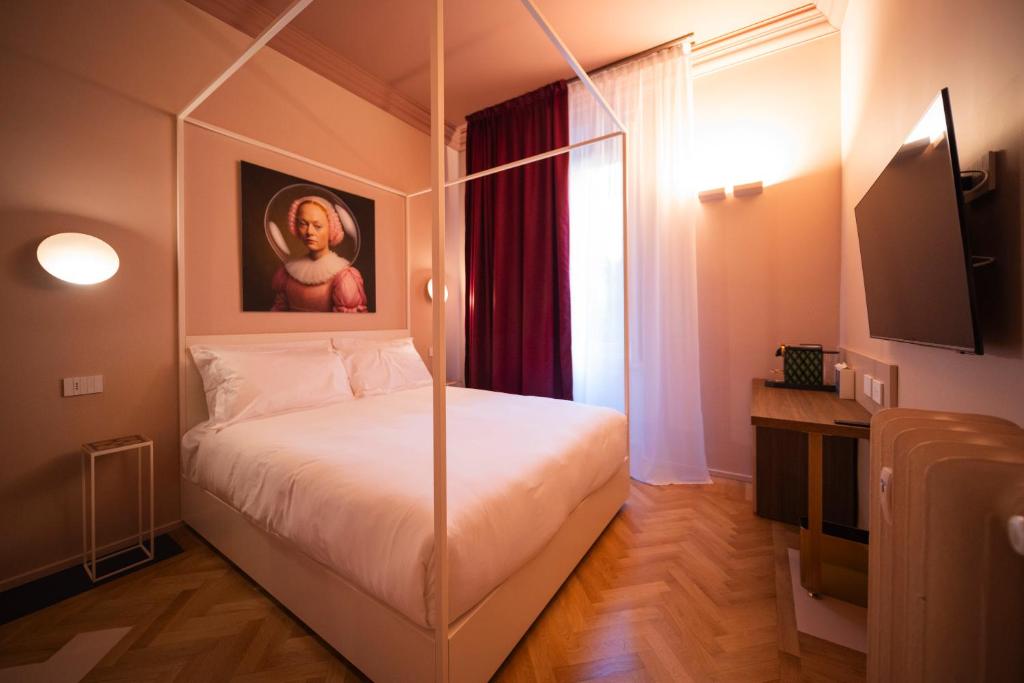 Postel nebo postele na pokoji v ubytování Fontana 16 Rooms