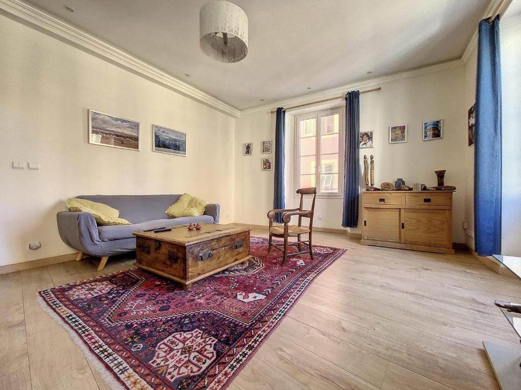 a living room with a couch and a coffee table at My Cosy Flat-Centre of Nice- Perfect location in Nice