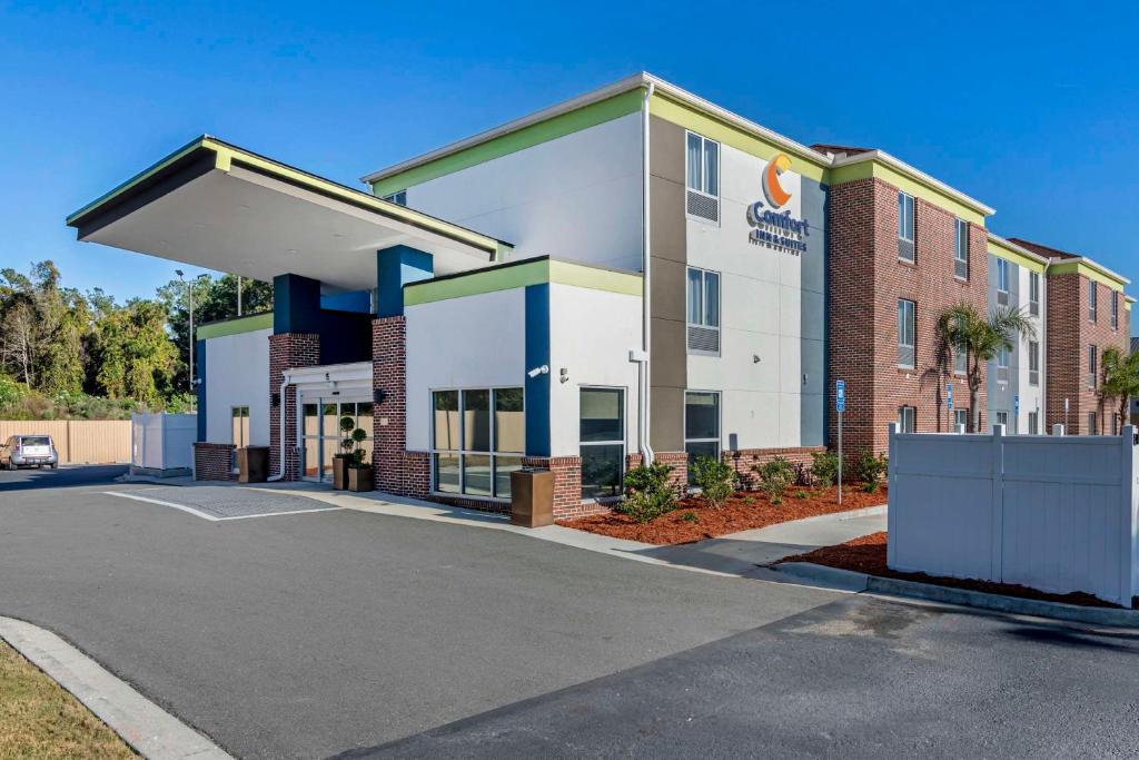 a building with a sign on the side of it at Comfort Inn & Suites in Brunswick