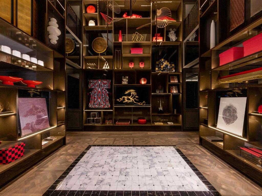 a dressing room with a tiled floor and shelves at Mercure Tokyo Haneda Airport in Tokyo