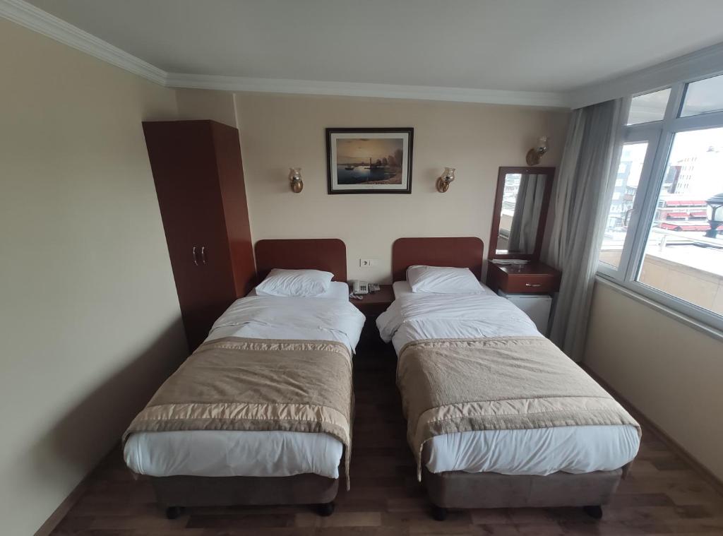 Postel nebo postele na pokoji v ubytování Hotel Akyildiz