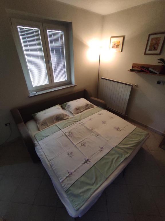 Postel nebo postele na pokoji v ubytování Apartma Laura