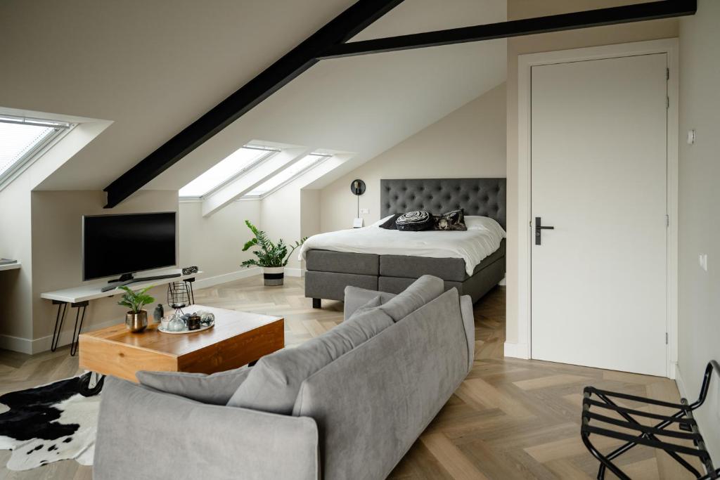 TV a/nebo společenská místnost v ubytování B&B de Cley