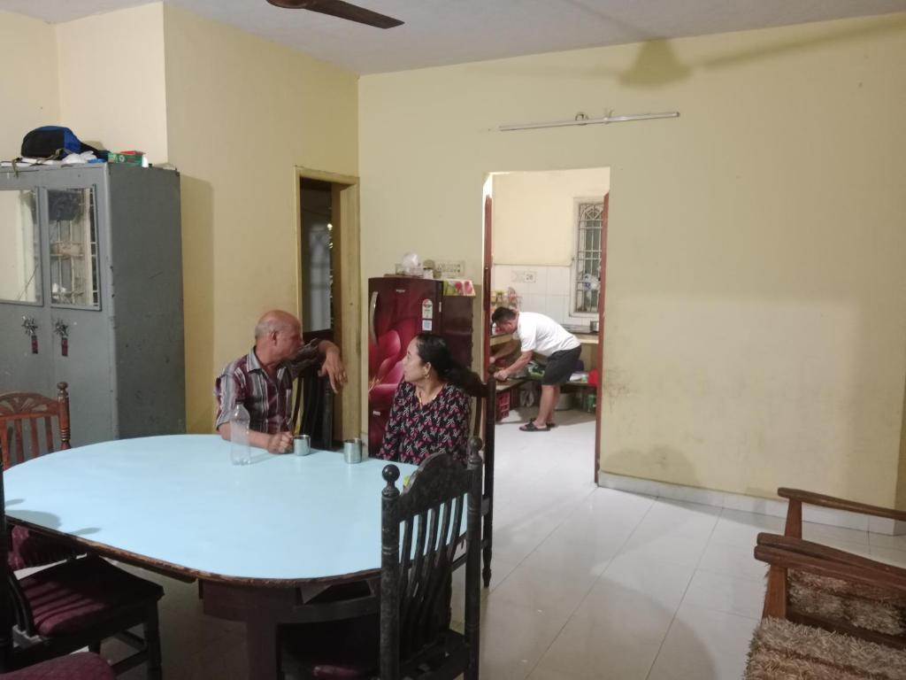 a man and a woman sitting at a table at Kalyani Dwarka Illam in Chennai