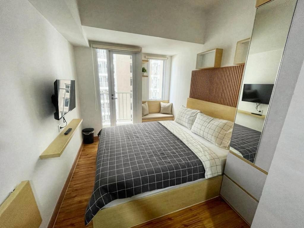 Postel nebo postele na pokoji v ubytování Didien's Apartment