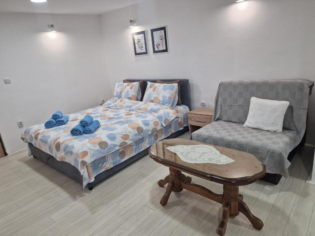 Postel nebo postele na pokoji v ubytování Zed apartmani Leskovac