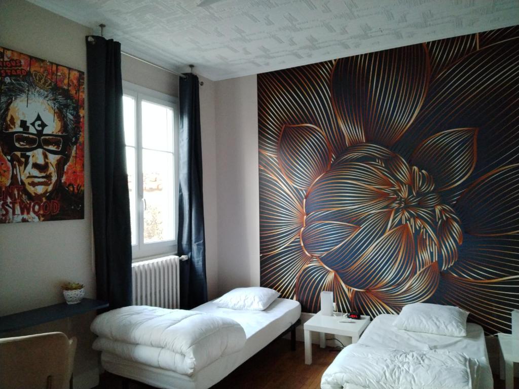 Cama ou camas em um quarto em Maison Diderot