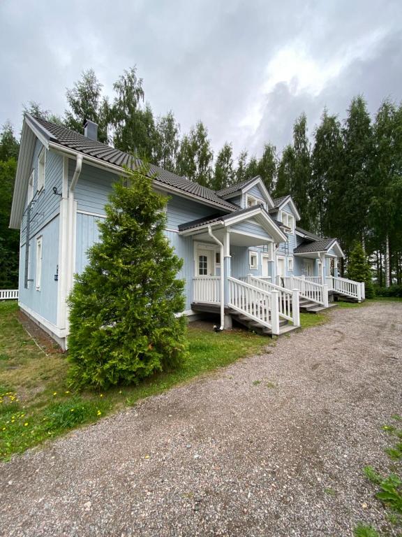 a row of houses with a driveway in front at Saimaa Houses in Imatra
