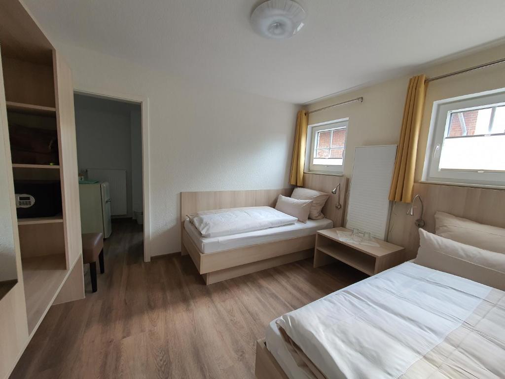 Postel nebo postele na pokoji v ubytování Hotel Deichinsel