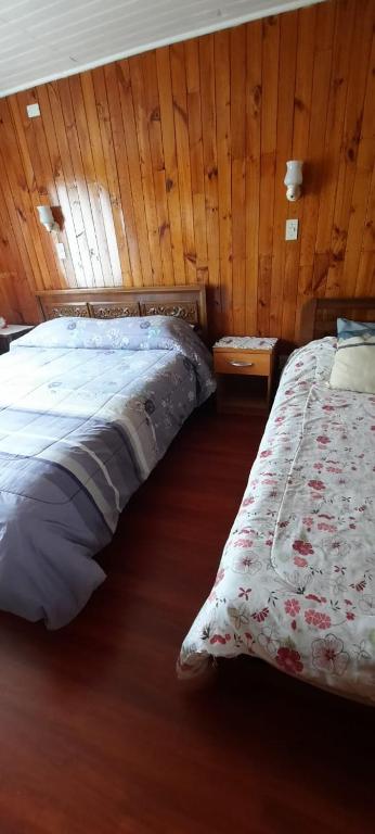 Postel nebo postele na pokoji v ubytování ALOJAMIENTO LAS LILAS